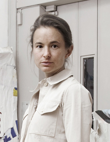 Magda Danysz in front of works by VHILS. Photo by Céline Barrère.